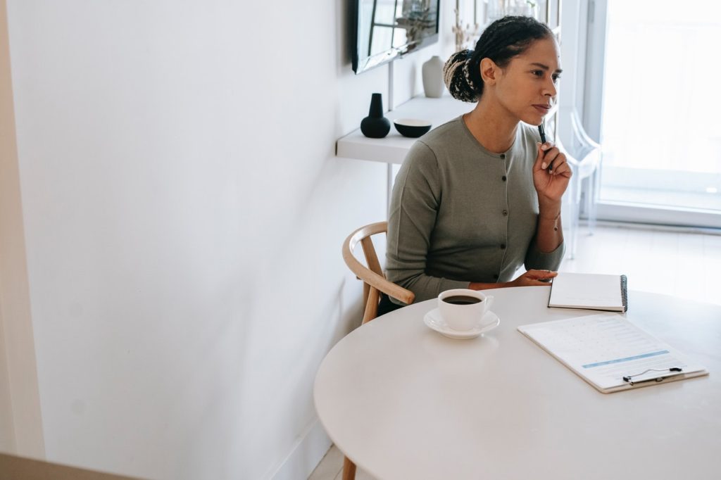 professional woman, desk, interview, cup of coffee, table